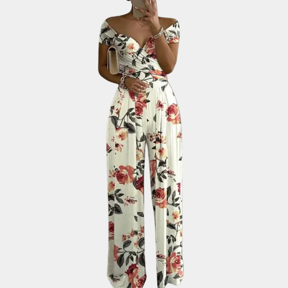 Dámský jumpsuit s květinovým vzorem a off-shoulder designem
