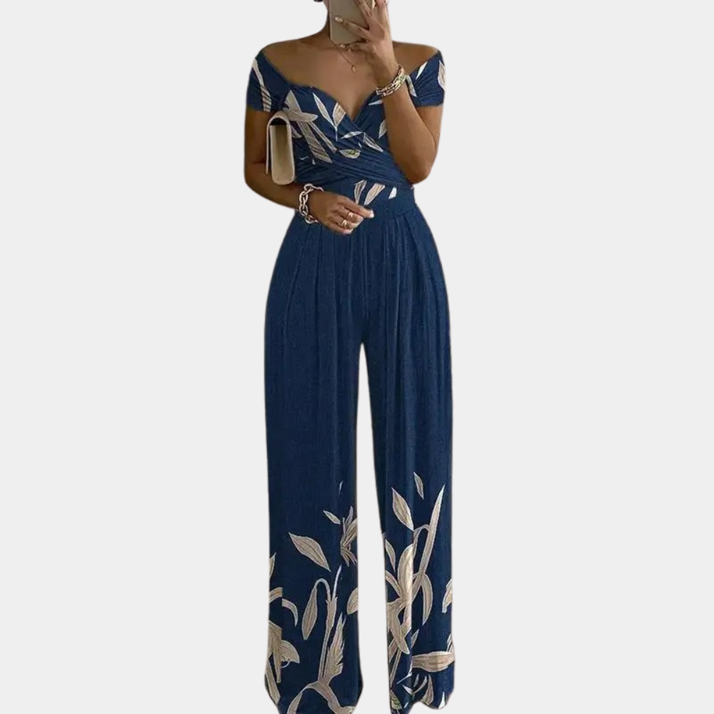 Dámský jumpsuit s květinovým vzorem a off-shoulder designem