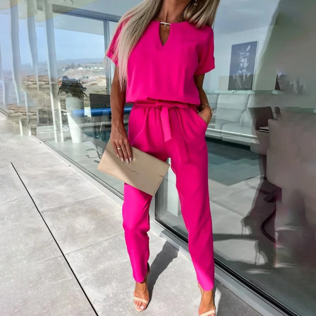 Dámský jumpsuit s v-halsline a elastickým pasem