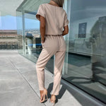 Dámský jumpsuit s v-halsline a elastickým pasem
