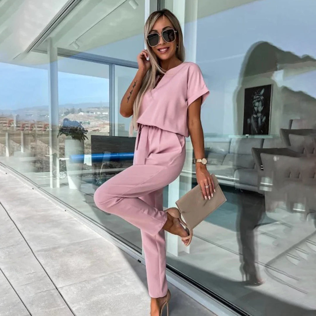Dámský jumpsuit s v-halsline a elastickým pasem