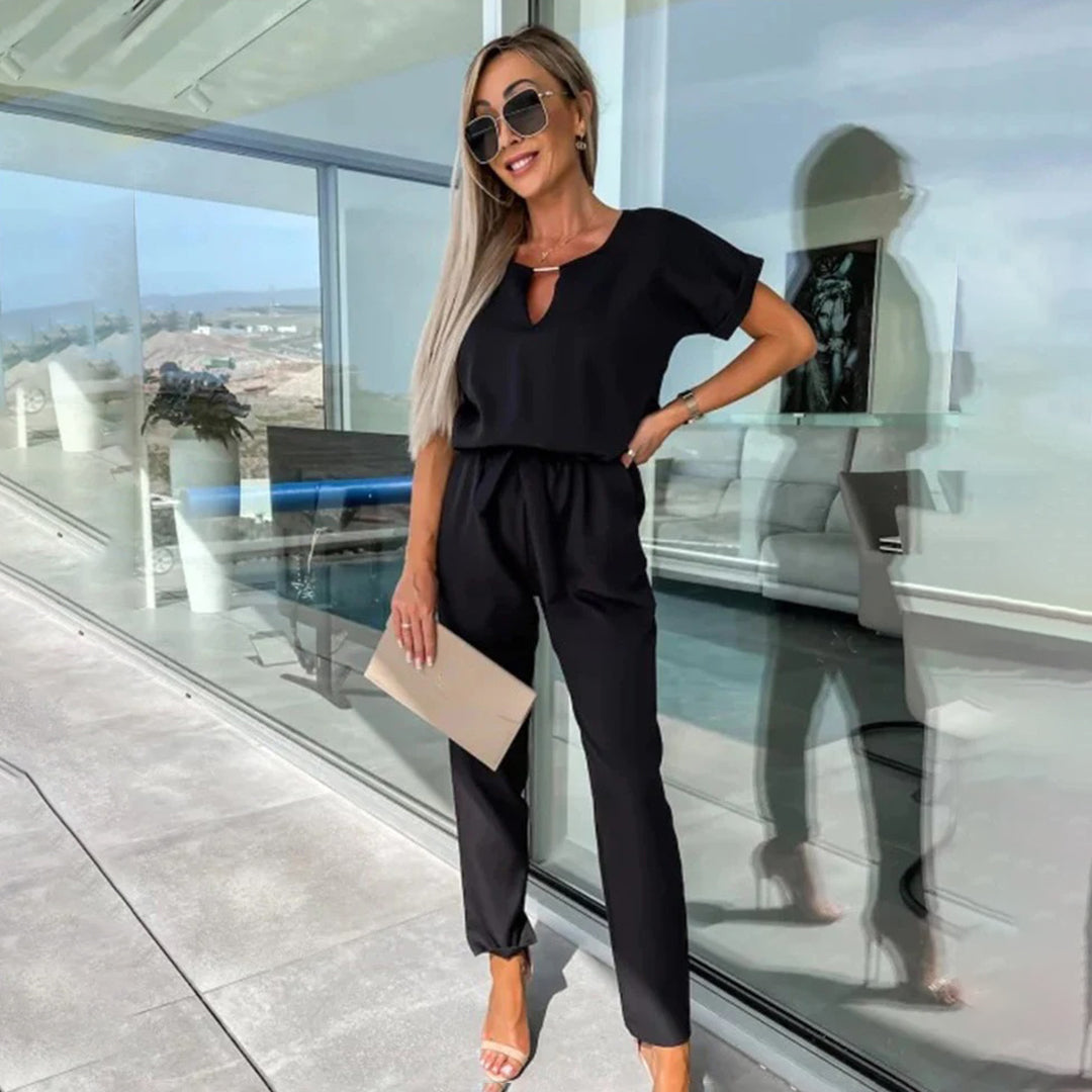 Dámský jumpsuit s v-halsline a elastickým pasem